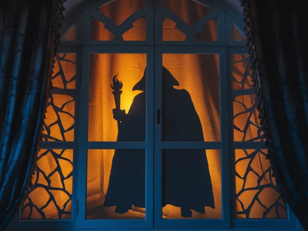 Halloween window showing shadow figure