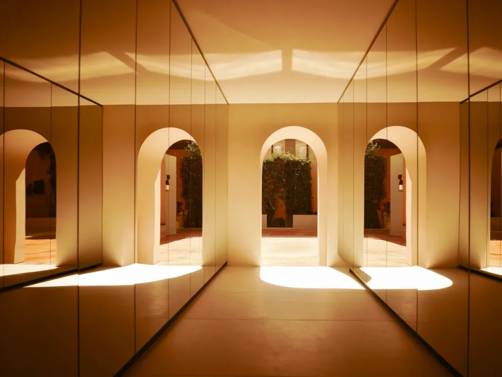 Hallway with large mirror wall panels 