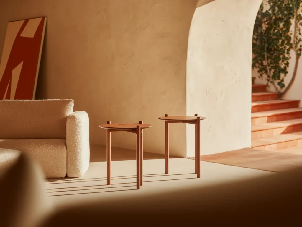 Neutral living room with slim wood side tables beside sofa